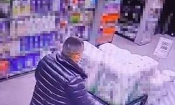 Marketten alkol çaldı, kimse görmeden şişeleri pantolonun içine soktu