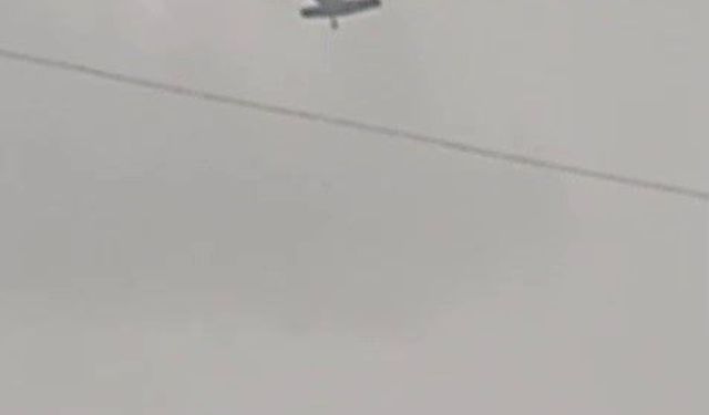 Askeri helikopter dolu ve yağmura yakalandı